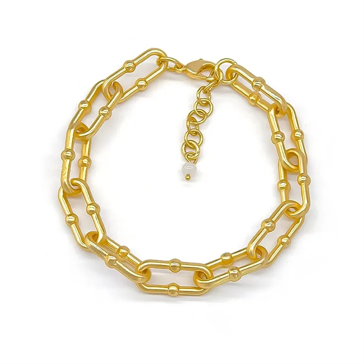 Arany gemkapocs karkötő